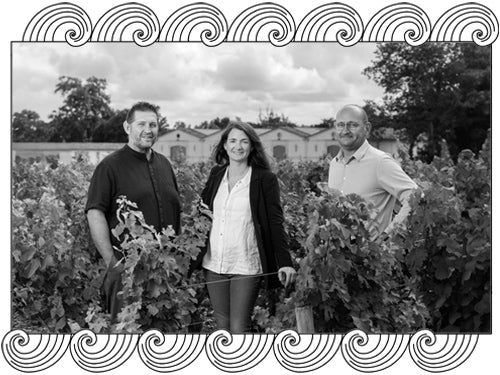 Château d'Armailhac winemakers in their Pauillac vineyard, framed with Dynamic Cellars wave design