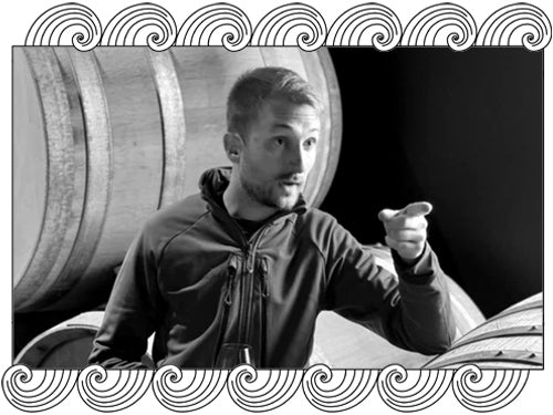 Benoît Doussot, Champagne Clandestin, tasting in his barrel cellar in the Côte des Bar, framed with Dynamic Cellars wave design