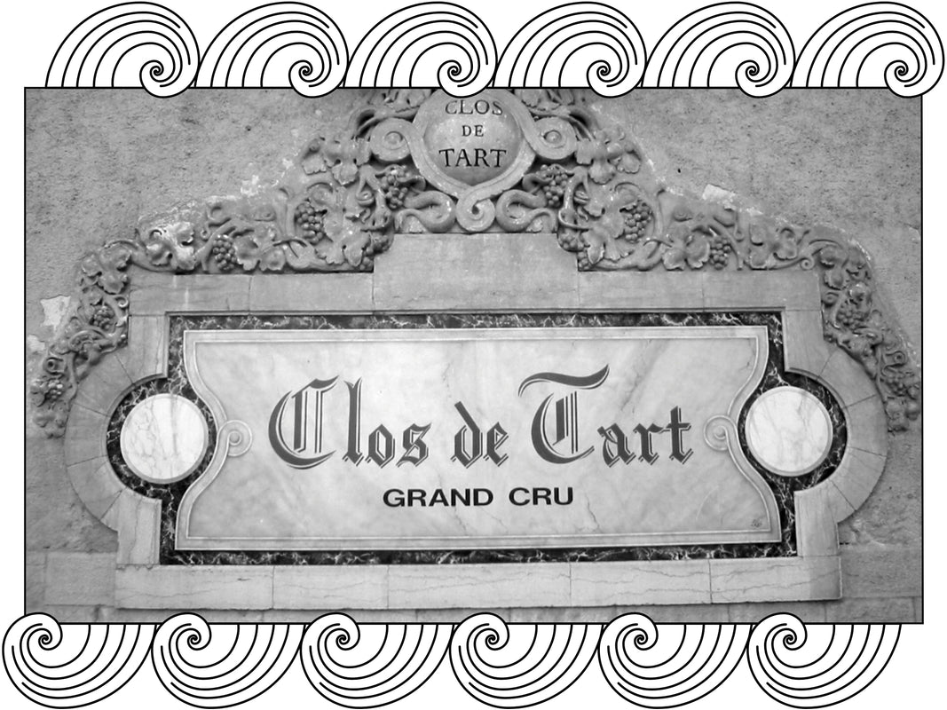 Domaine du Clos de Tart: carved stone sign of the Clos de Tart Grand Cru estate wall, framed with Dynamic Cellars wave design