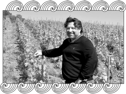 Frédéric Savart, Champagne winemaker, tending his Montagne de Reims vines, framed with Dynamic Cellars wave design
