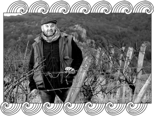 Jean-François Ganevat, Jura winemaker, among his dormant vines, framed with Dynamic Cellars wave design