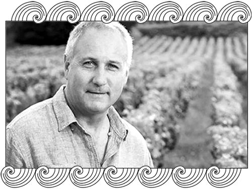 Jean Grivot, Vosne-Romanée winemaker, among his Côte de Nuits vines, framed with Dynamic Cellars wave design
