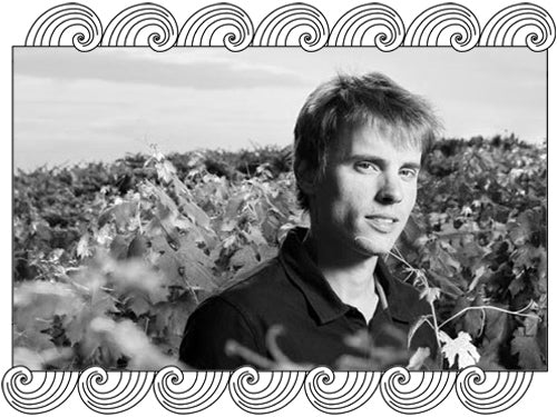 Valentin Morel, Jura winemaker, among the vines at Domaine Les Pieds sur Terre, framed with Dynamic Cellars wave design