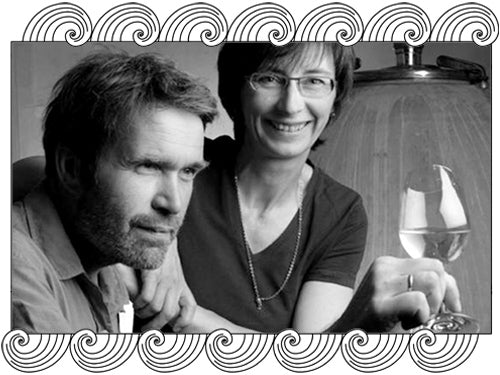 Domaine Trapet Père & Fils, Gevrey-Chambertin winemakers tasting in their cellar, framed with Dynamic Cellars wave design