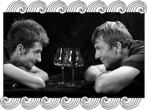 Domaine Nervi, Gattinara winemakers facing each other over wine glasses, framed with Dynamic Cellars wave design