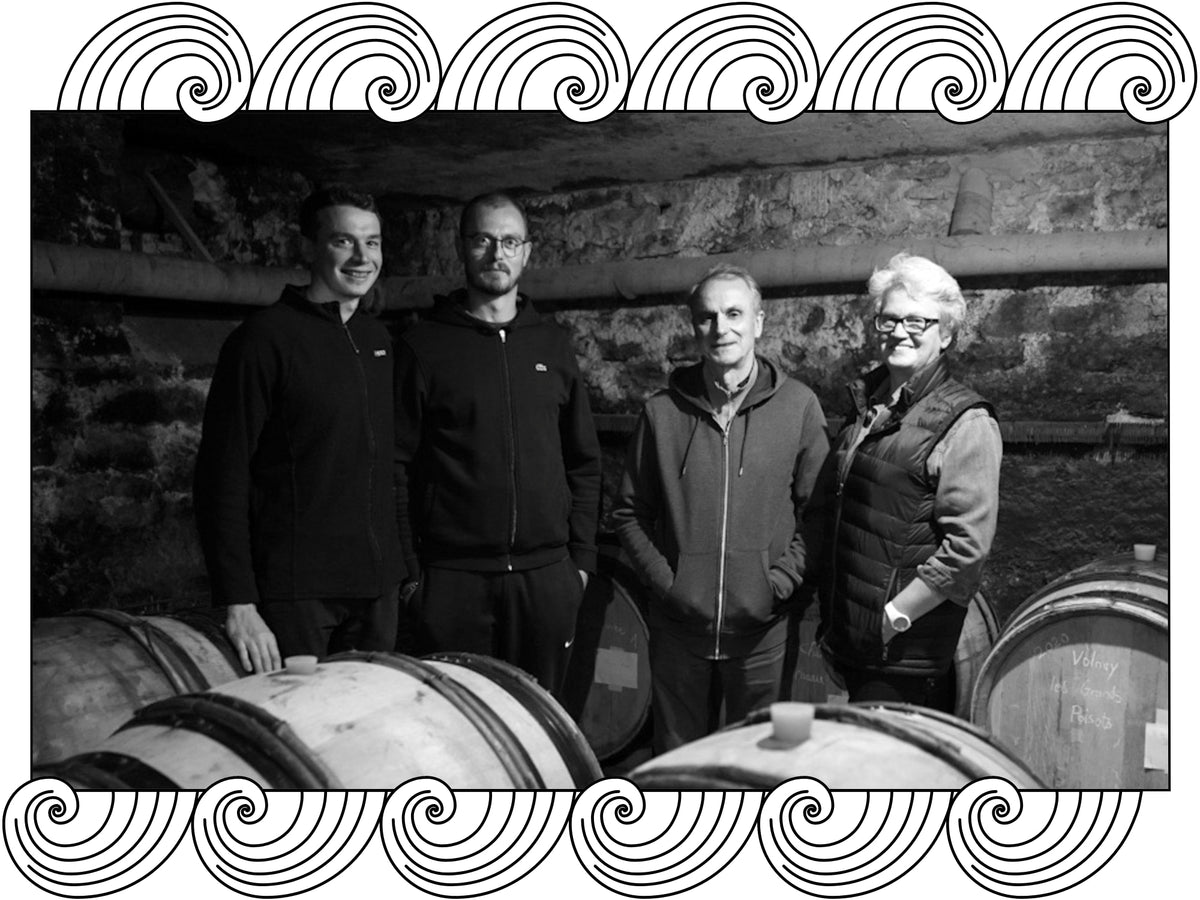 François Millet & Fils, the family together in their barrel cellar, framed with Dynamic Cellars wave design