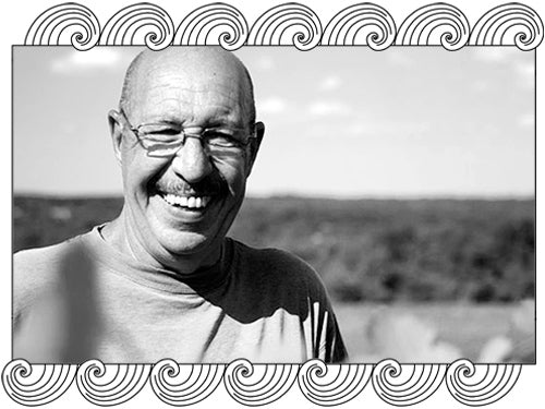 Maison en Belles Lies winemaker among his Burgundy vines, framed with Dynamic Cellars wave design