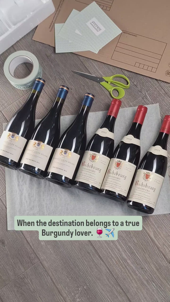 Hand-packing six fine Burgundy wines for shipping to Bratislava