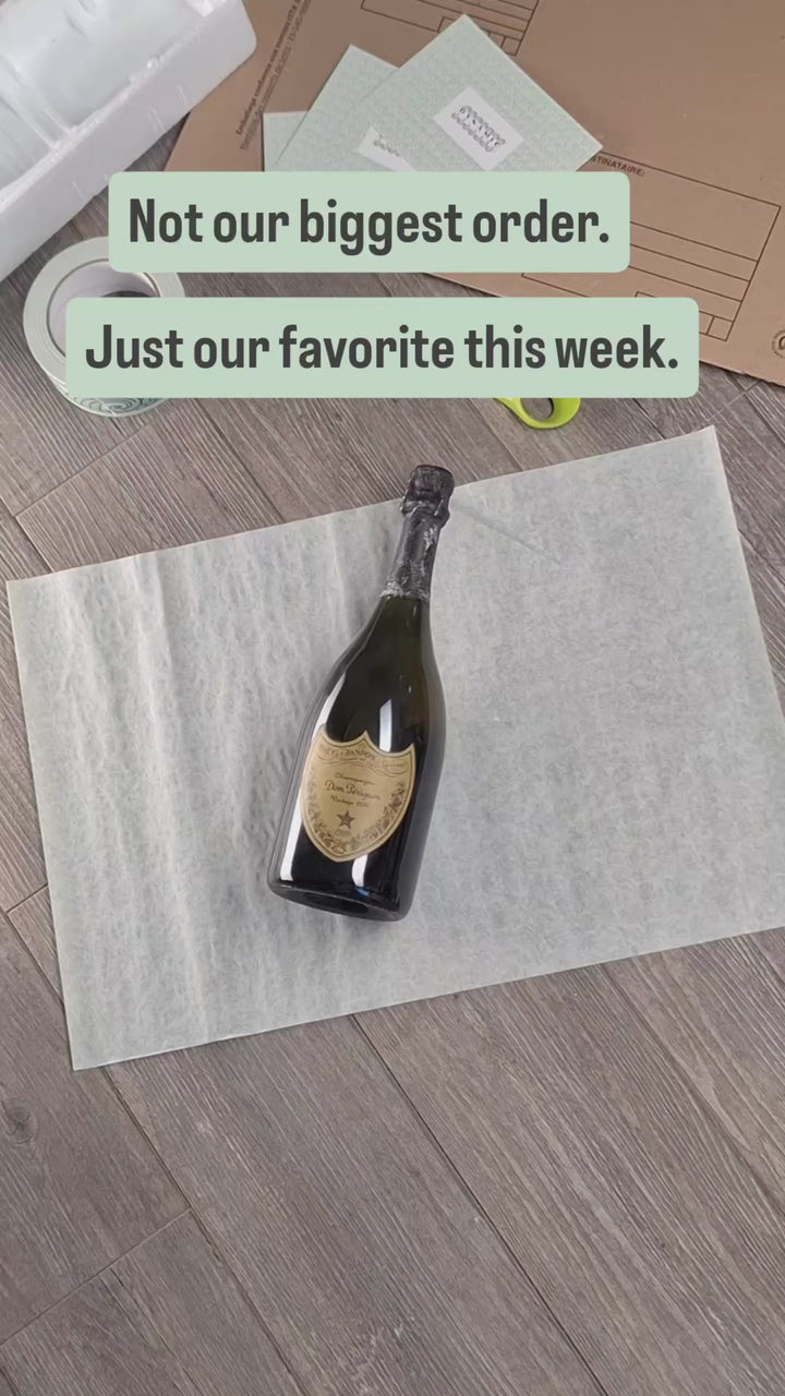 Hand-packing a bottle of Dom Pérignon 1996 for shipping to Geneva