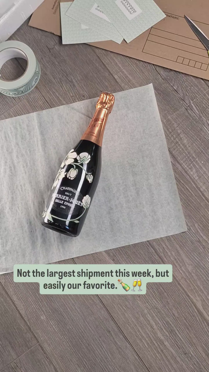 Hand-packing a bottle of Perrier-Jouët 1990 Champagne for shipping to Luxembourg