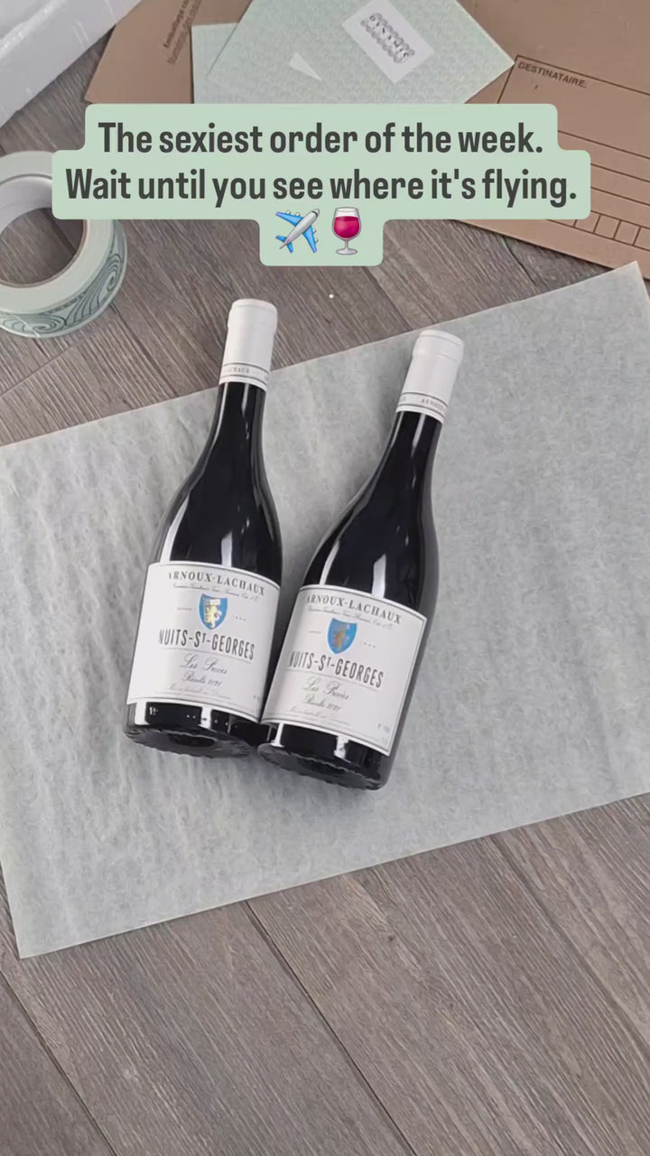 Hand-packing Nuits-Saint-Georges Les Procès, Domaine Arnoux-Lachaux, for shipping to Budapest