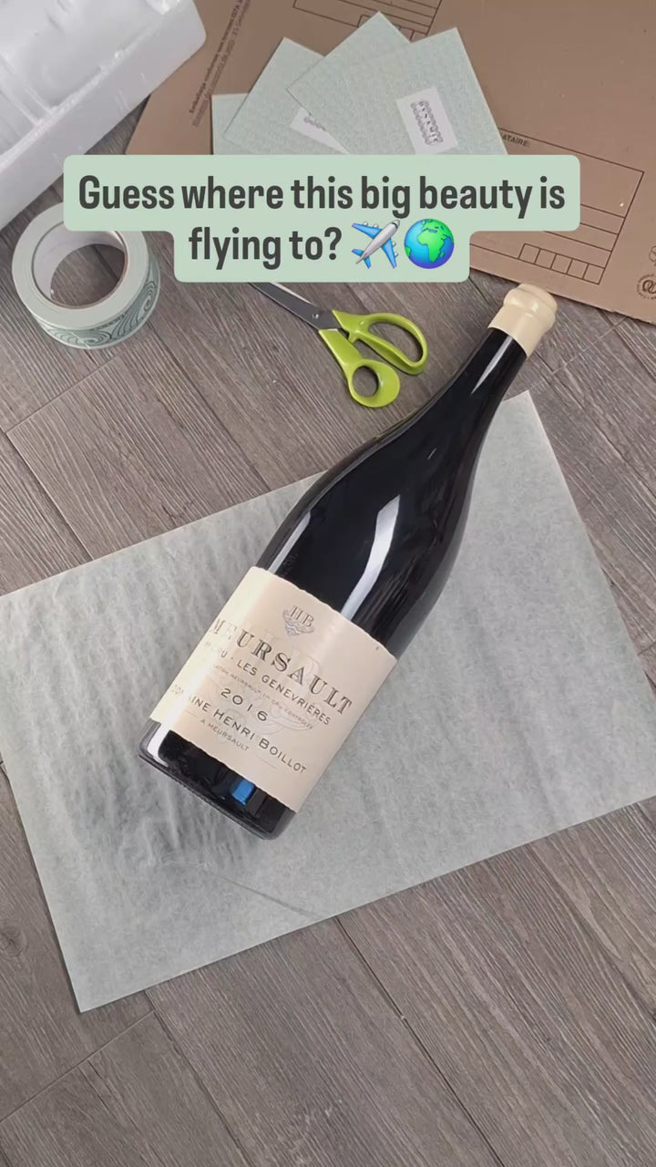 Hand-packing a magnum of Meursault Les Genevrières 2016, Domaine Henri Boillot, for shipping to Singapore