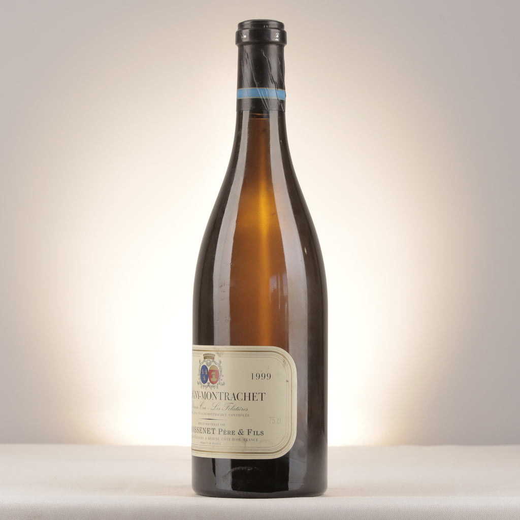 Remoissenet Père et Fils Puligny-Montrachet 1er Cru Les Folatières 1999 Bottle turned left (lot d2ad)