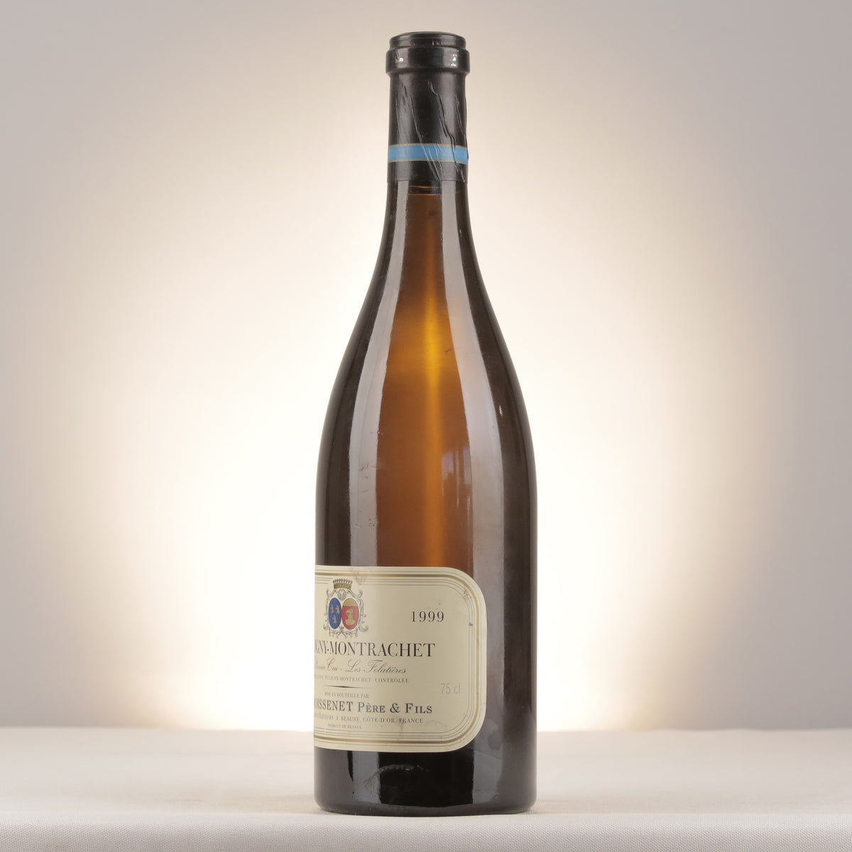 Remoissenet Père et Fils Puligny-Montrachet 1er Cru Les Folatières 1999 Bottle turned left (lot d2ad)
