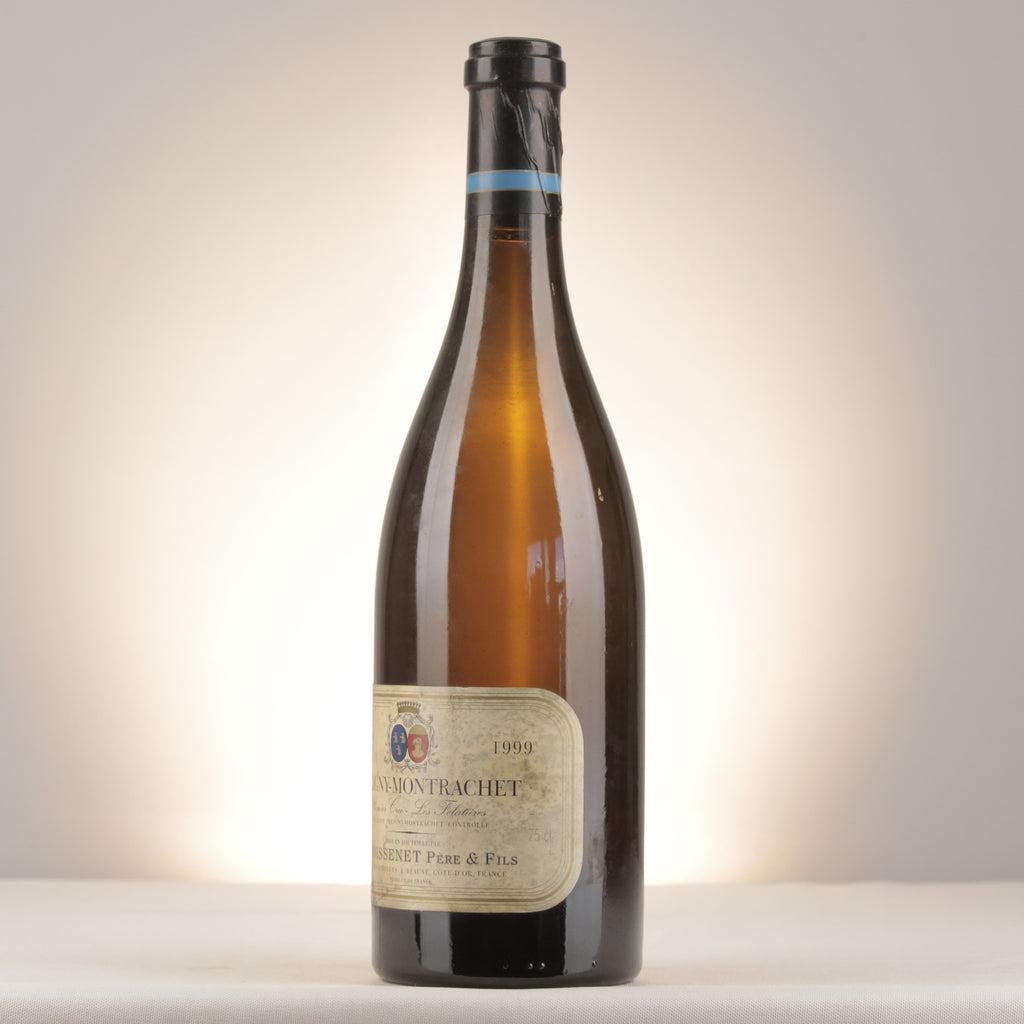 Remoissenet Père et Fils Puligny-Montrachet 1er Cru Les Folatières 1999 Bottle turned left (lot dda8)