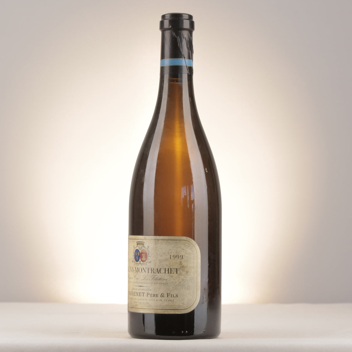 Remoissenet Père et Fils Puligny-Montrachet 1er Cru Les Folatières 1999 Bottle turned left (lot dda8)