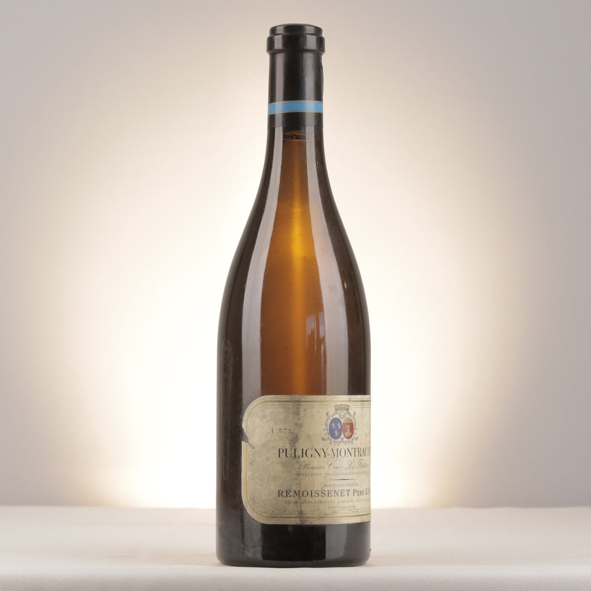 Remoissenet Père et Fils Puligny-Montrachet 1er Cru Les Folatières 1999 Bottle turned right (lot dda8)