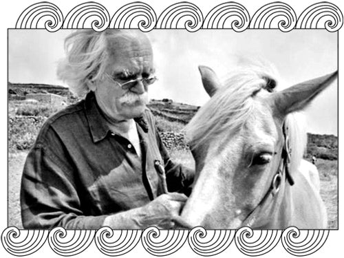 Serragghia winemaker with a horse on his Pantelleria estate, framed with Dynamic Cellars wave design